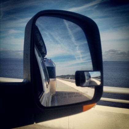 the Gulf of Mexico, and an Airstream, in a rearview mirror