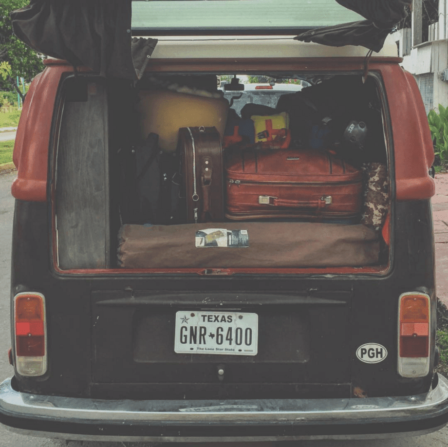 suitcases in the back of a vw bus