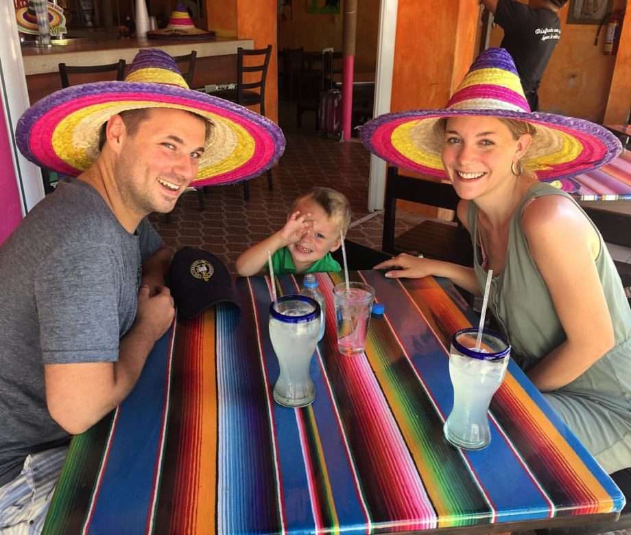 a family in sombreros at a mexican restaurant