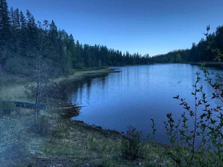 a blue alpine lake at dusk