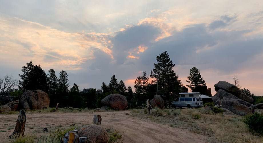 a van camps in the forest outside of Laramie, Wyoming