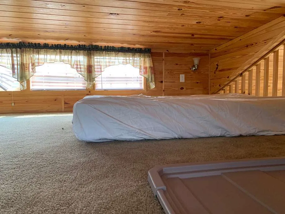 simple but useful loft, short ceiling, a twin bed