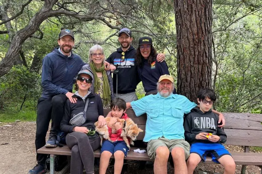 a relatively large family at a picnic table