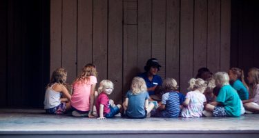 children listening to a young ranger at yosemite